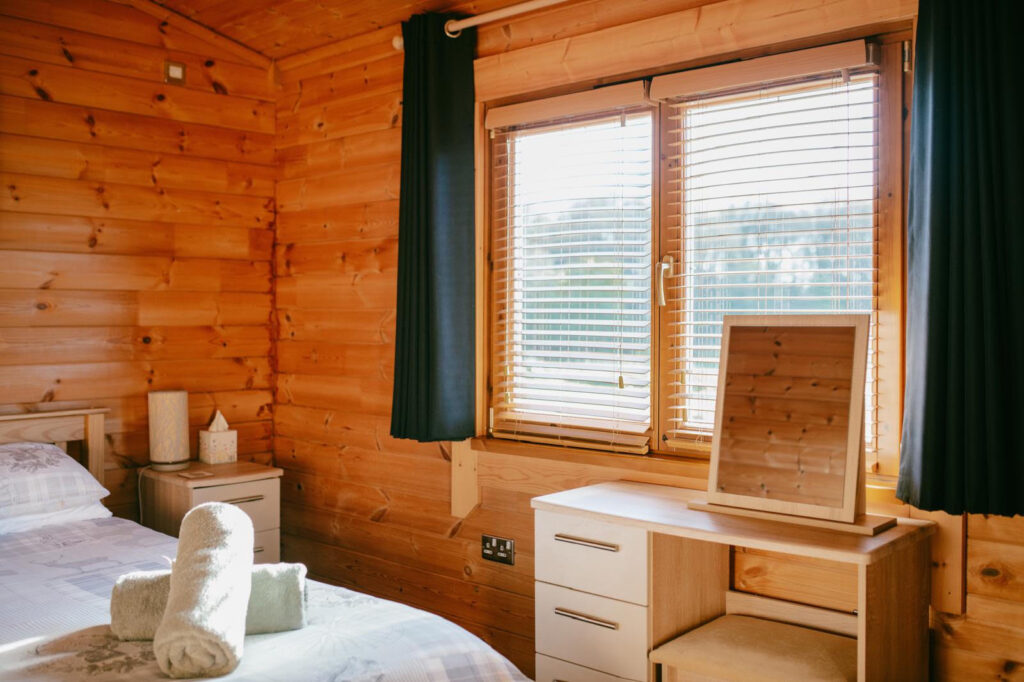 Bedroom inside a log cabin at Forest View Retreat near Bewdley